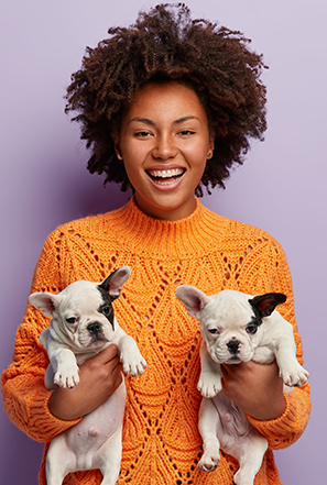 brown girl holding puppy.jpg